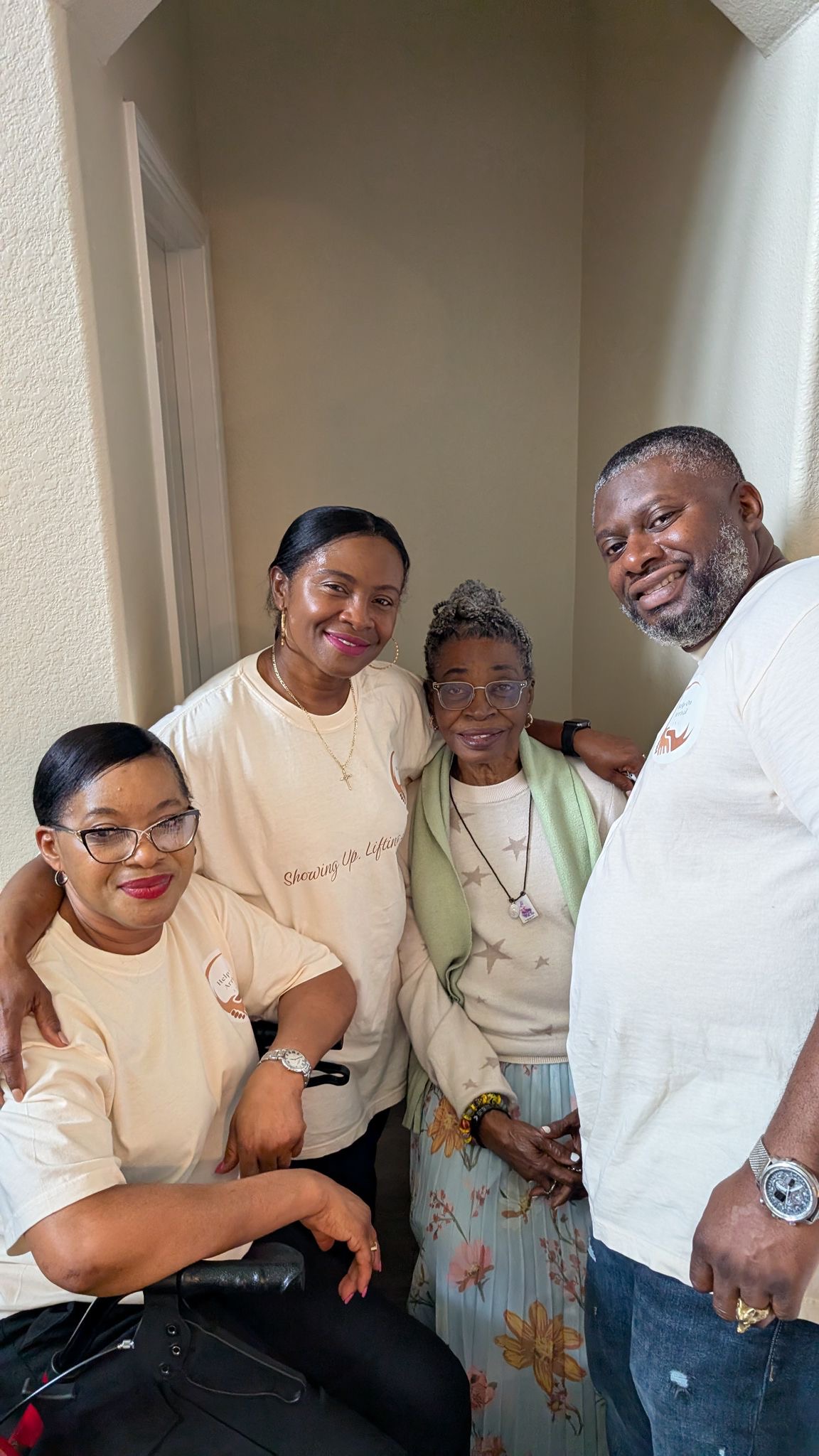 Help On Arrival team members sharing a meaningful moment with an elder at the grand opening.