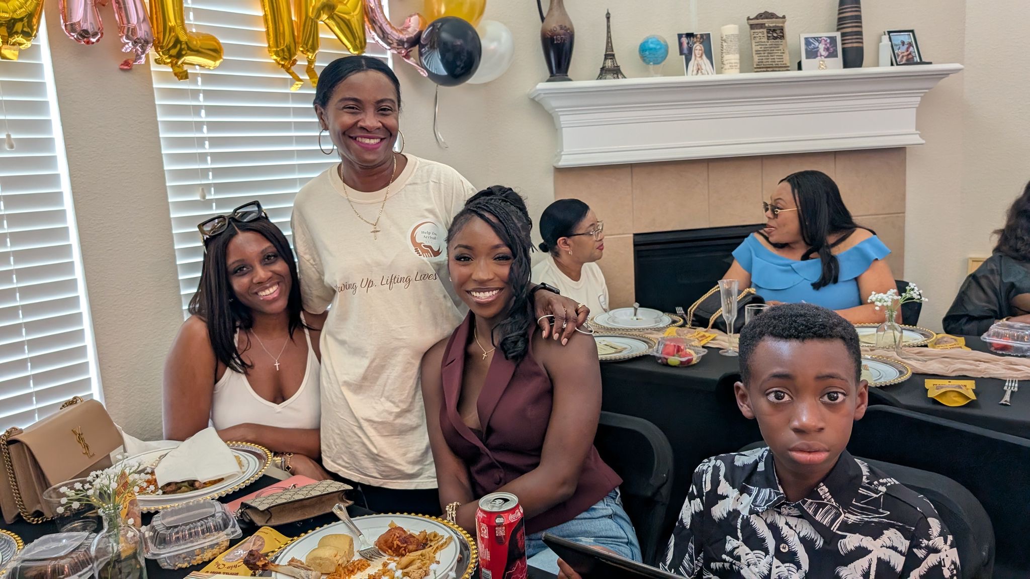 Families and supporters sharing a table moment at the launch event.