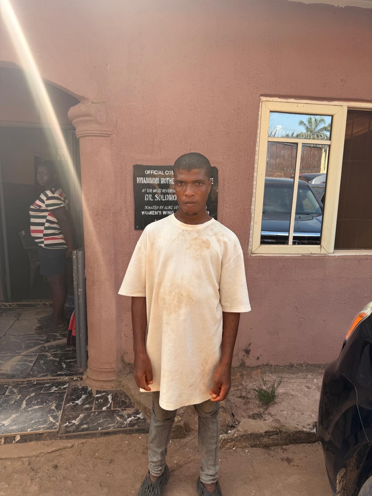 A community member standing outside the orphanage during the December event.