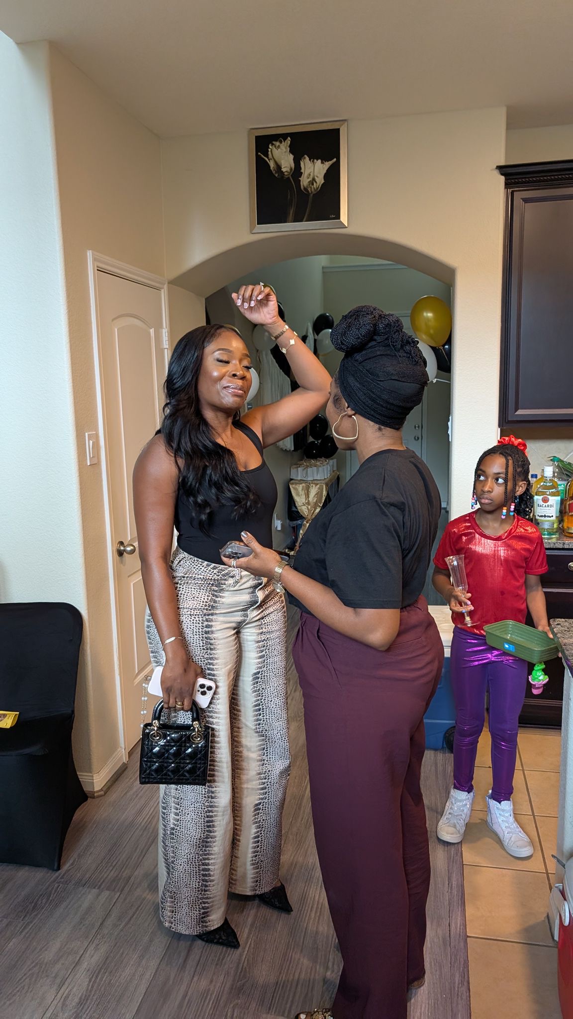 A candid preparation moment with volunteers and family during the December visit.
