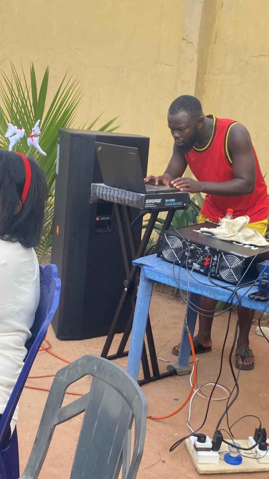 A sound technician setting up equipment during the December field event.