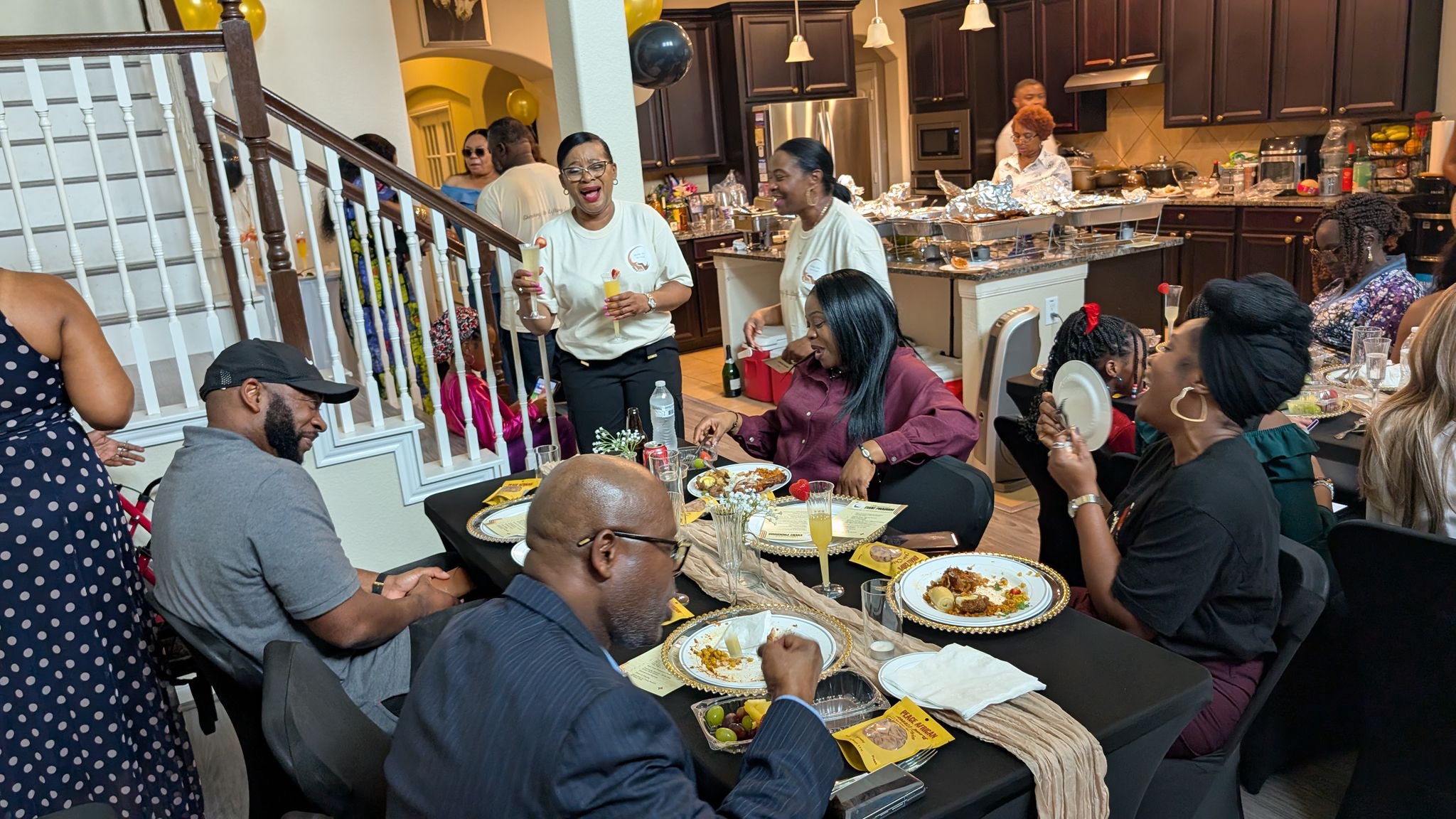 Community members seated together for a meal during the December gathering.