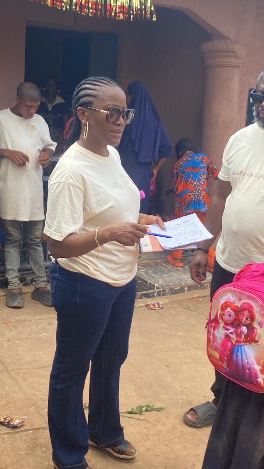 A Help On Arrival team member checking notes during the field visit.